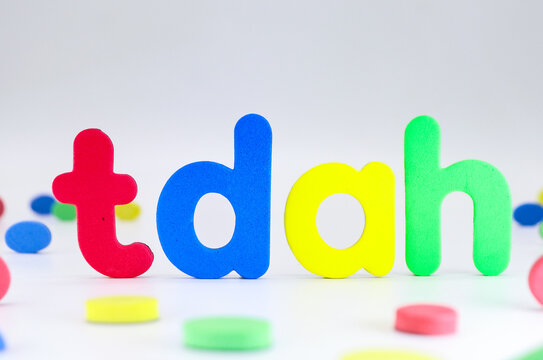 Attention Deficit Hyperactivity Disorder abbreviation. Spanish acronym TDAH with colorful letters on white background - Powered by Adobe