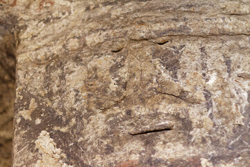 Interior of a pre-Columbian hypogea in Tierradentro, Inza, Cauca, Colombia. Geometric, anthropomorphic and zoomorphic patterns on the wall.