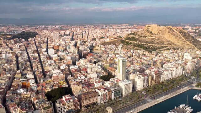 Aerial drone perspective. Castle of Santa B&aacute;rbara on top of the hill. Famous travel destination. Sunset point. Orange and pink reflections. Historic city center.