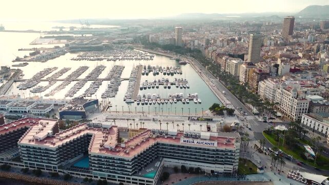 Panoramic aerial view of Alicante Marina. View of the main boulevard of the city and promenade area. Famous travel destination in South of Spain.
Drone forward.