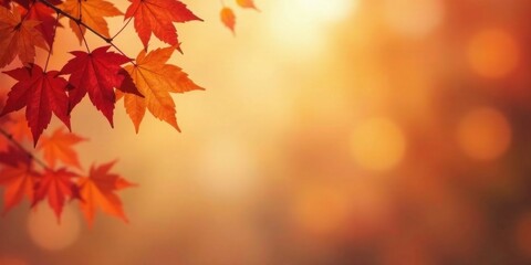 Fototapeta premium Autumnal foliage with warm-toned bokeh background ideal for seasonal designs and greeting cards.