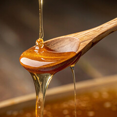 honey dripping from spoon, Close up of honey dripping