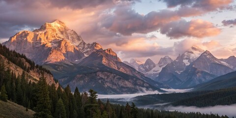 Fototapeta premium Ethereal Glow Over Majestic Mountain Peaks at Sunrise - Landscape Photography