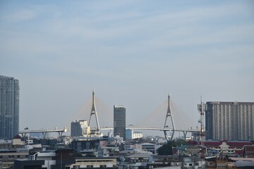 bridge and building cityscape on river in sunset at Thailand