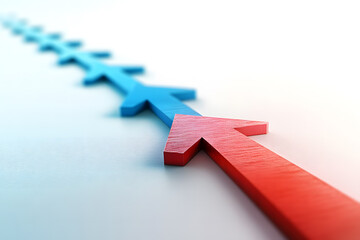 Red and Blue Wooden Arrows Pointing Left on Minimalist Background