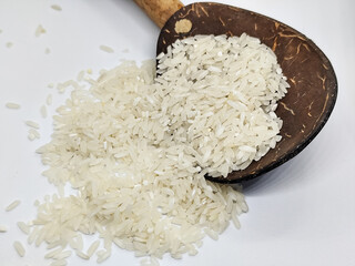 Unprocessed rice, on a natural blurred white background.