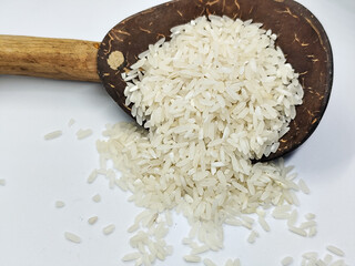 Unprocessed rice, on a natural blurred white background.