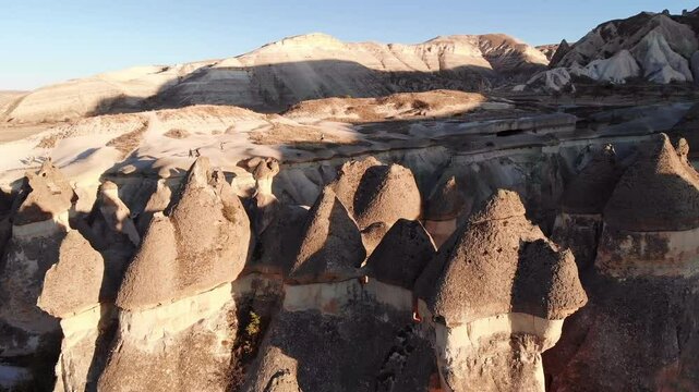 Aerial view of Cappadocia  unique rock formations at sunrise captured by drone.