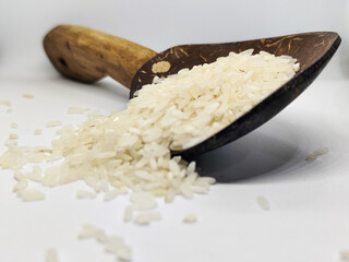 Unprocessed rice, on a natural blurred white background.