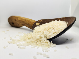 Unprocessed rice, on a natural blurred white background.