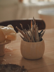 Artist's brushes for paints and painting. The artist's instruments in the studio. Creativity. Multi-colored paintbrushes for drawing and painting