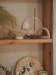 Beautiful clay vases, jugs, mugs, plates in a pottery studio. Artist's creativity. Multi-colored dishes. Hand made