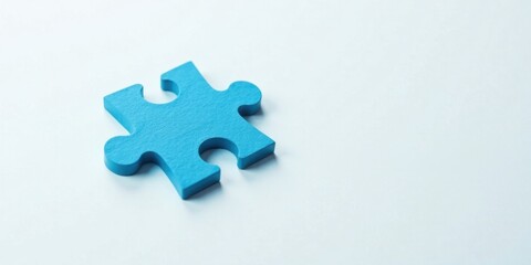 Obraz premium A Single Blue Jigsaw Piece on a Light Background Representing a Missing Element in a Larger Picture, Symbolizing the Need for Completion and the Importance of Finding the Right Fit