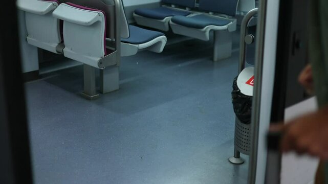 closeup of Traveler hand pressing train door button to open, 4k video