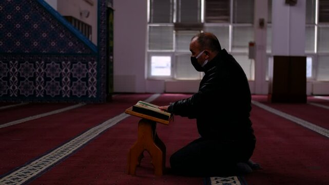 The Mature Mask Man Who Reads the Quran