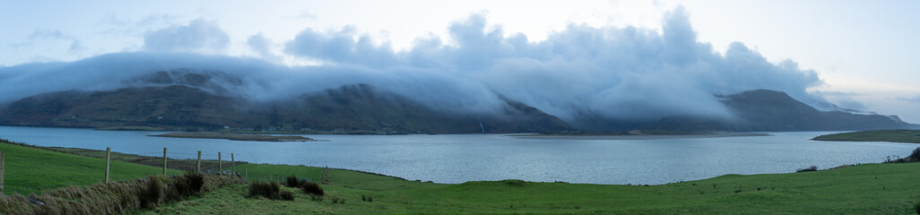 Panorama. View of mountains in the fog and a Assaranca waterfall. Donegal, Ardara. 