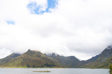 Panoramic view on the mountain range on the island of Austvagoya on a fjord on the Lofoten island...