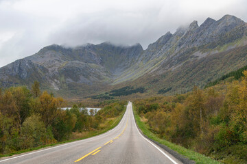 Drivers perspective view over European road E10 on Lofoten island chain archipelago in Norway with...