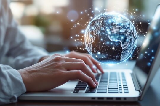 Hands typing on a laptop with a digital globe representing global connectivity and technology on blurred background.