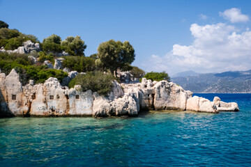 Sunken Lycian town view on Kekova island near Kas, Antalya district, Turkiye. The Kekova region is steeped in history, with ruins of ancient settlements around every corner. The turquoise water 