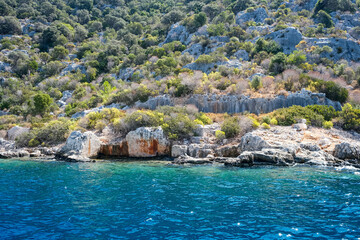 Sunken Lycian town view on Kekova island near Kas, Antalya district, Turkiye. The Kekova region is steeped in history, with ruins of ancient settlements around every corner. The turquoise water 
