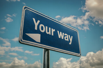 Rustic "Your Way" Sign with Scenic Road in the Background under a Clear Blue Sky