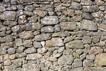 Detail of a granite wall part of an old historic house Portugal