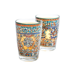 Two ornate glasses with tea intricate design