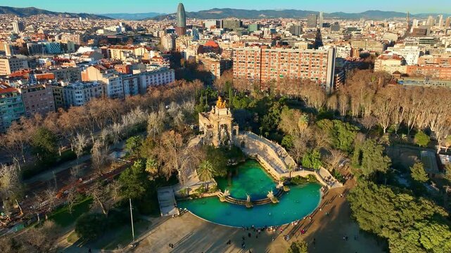 Barcelona city aerial view with Parc de la Ciutadella at sunset, drone view of Barcelona downtown, tourism in Barcelona, Spain