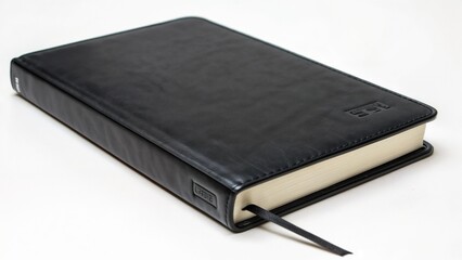 Closed black leather-bound book with a bookmark resting on a white background