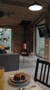 A Cozy Modern Interior featuring a Stylish Fireplace and Comfortable Seating for Relaxation. Vertical video