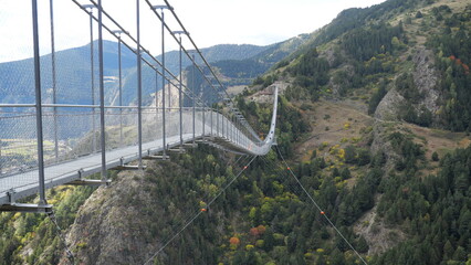 The Andorra Tibetan Bridge, known as Pont Tibetà Canillo, stretches high above a deep valley,...
