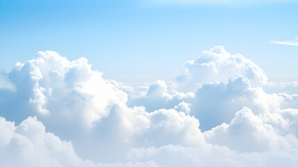 Aerial view of fluffy white clouds under a bright blue sky, perfect for travel or nature backgrounds