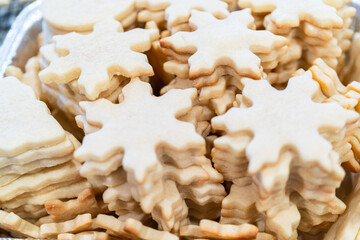 Baking Snowflake-Shaped Sugar Cookies for Homemade Christmas Gifts