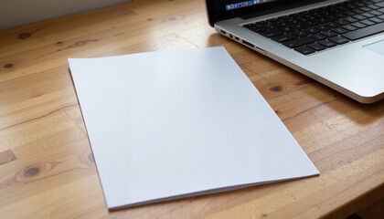 Photorealistic A4 Paper Mockup with Laptop, blank sheet on wooden desk, professional workspace setup