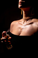 An Elegant Woman Adorned with Perfume Captured Beautifully in Stunning Dramatic Lighting