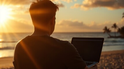 A man working remotely on a laptop by the beach with palm trees and a beautiful ocean view