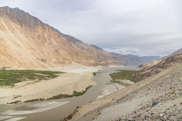 Himalayan mountains of Nubra Valley in the morning, and Shyok River, part of the Silk Road, north of Leh, Ladakh, Jammu and Kashmir, India.