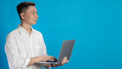 Confident young businessman in white shirt standing typing on laptop in various emotions