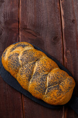 Traditional Jewish holiday challah homemade on table on wooden board