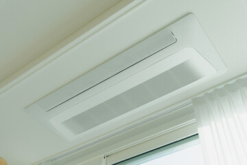 Obraz premium Ceiling-mounted air conditioning unit