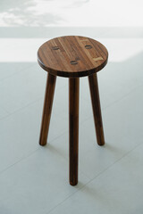 Wooden stool on light floor