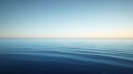 Fototapeta premium Serene Blue Ocean Horizon Extending Under a Clear, Gradient Sky