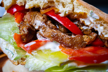 Delicious sandwich filled with grilled chicken and fresh vegetables
