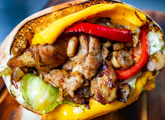 Delicious grilled sandwich with savory meat and fresh vegetables © Serhii