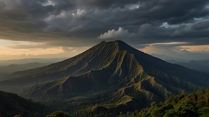 Fototapeta premium A majestic mountain landscape under dramatic clouds during sunset.