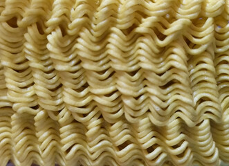 Dry instant noodles. Uncooked ramen noodles. Dry noodle background.