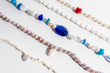 Pearl jewelry on white background. Necklace or bracelet