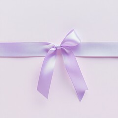 Lavender satin ribbon bow on light purple background.