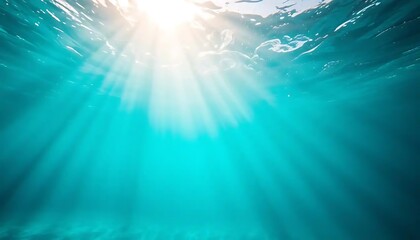 Obraz premium Underwater Sunlight Beams Illuminate Turquoise Ocean Depths